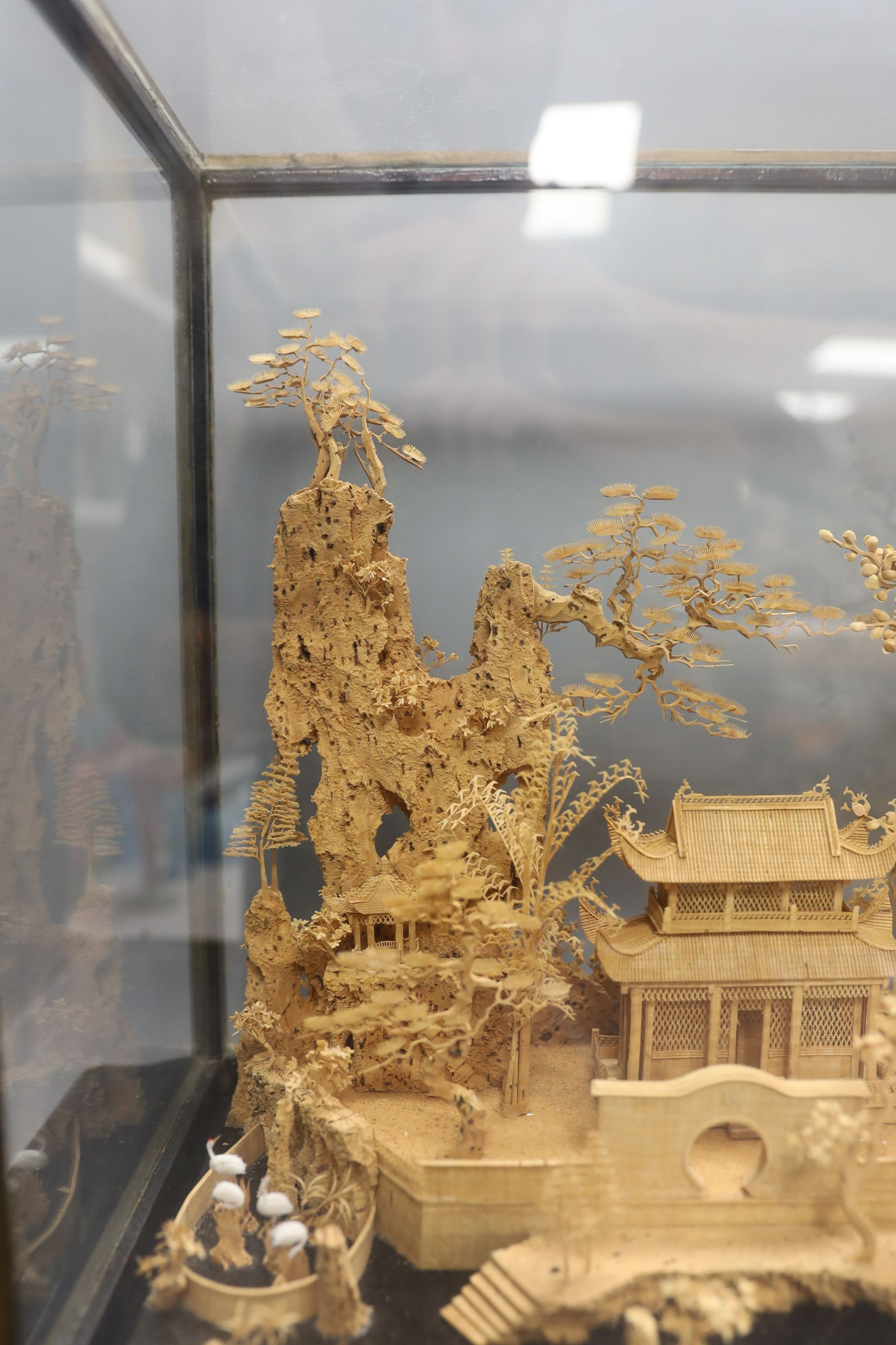A large Chinese export Ruanmu Hua carved cork diorama, depicting a pagoda on stand - 35.5cm tall including case